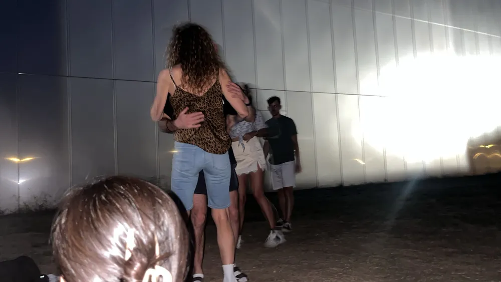 Guests dancing beside Théâtre de Vidy at night